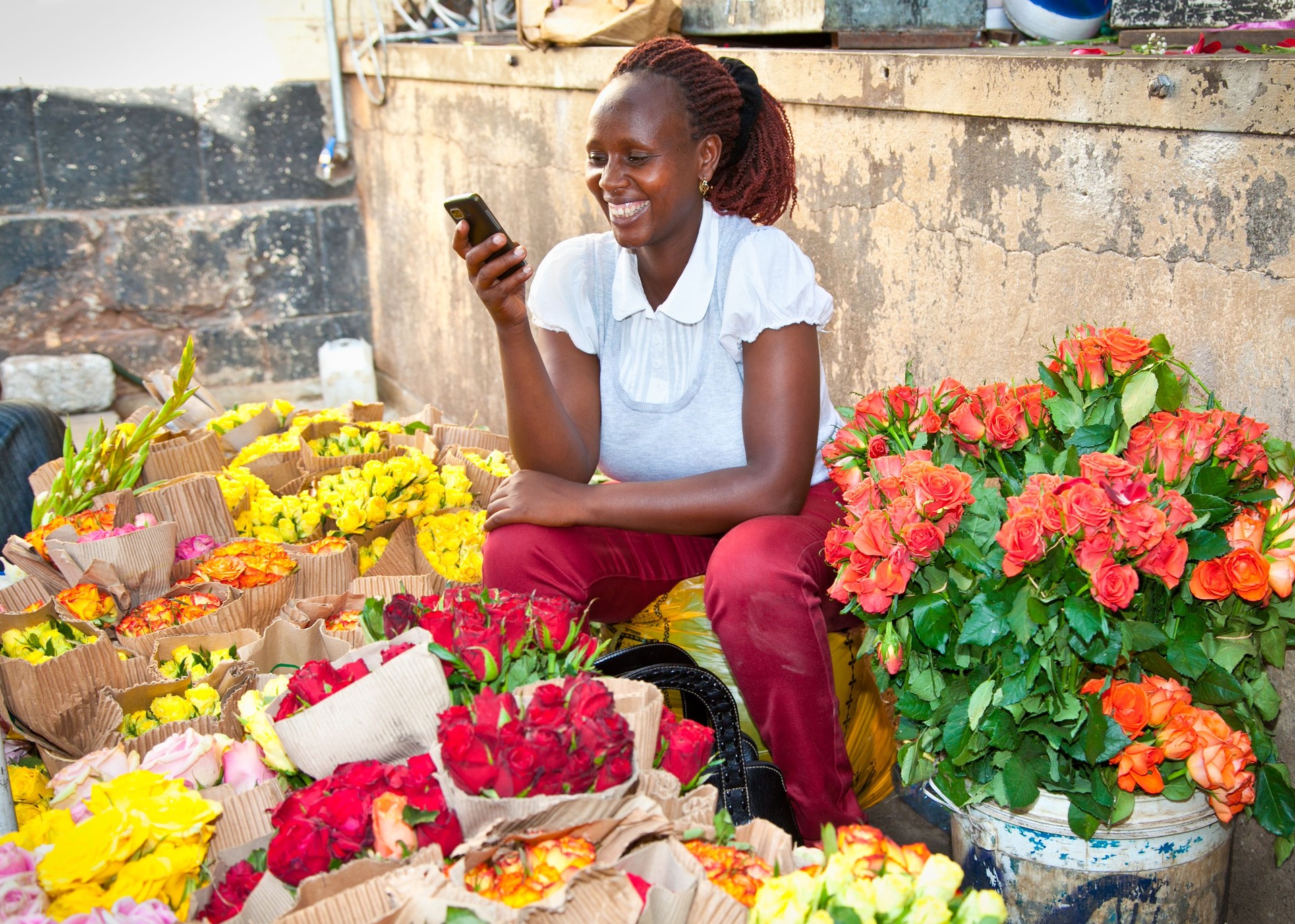 Woman sells flowers at old market in centre of Nairobi